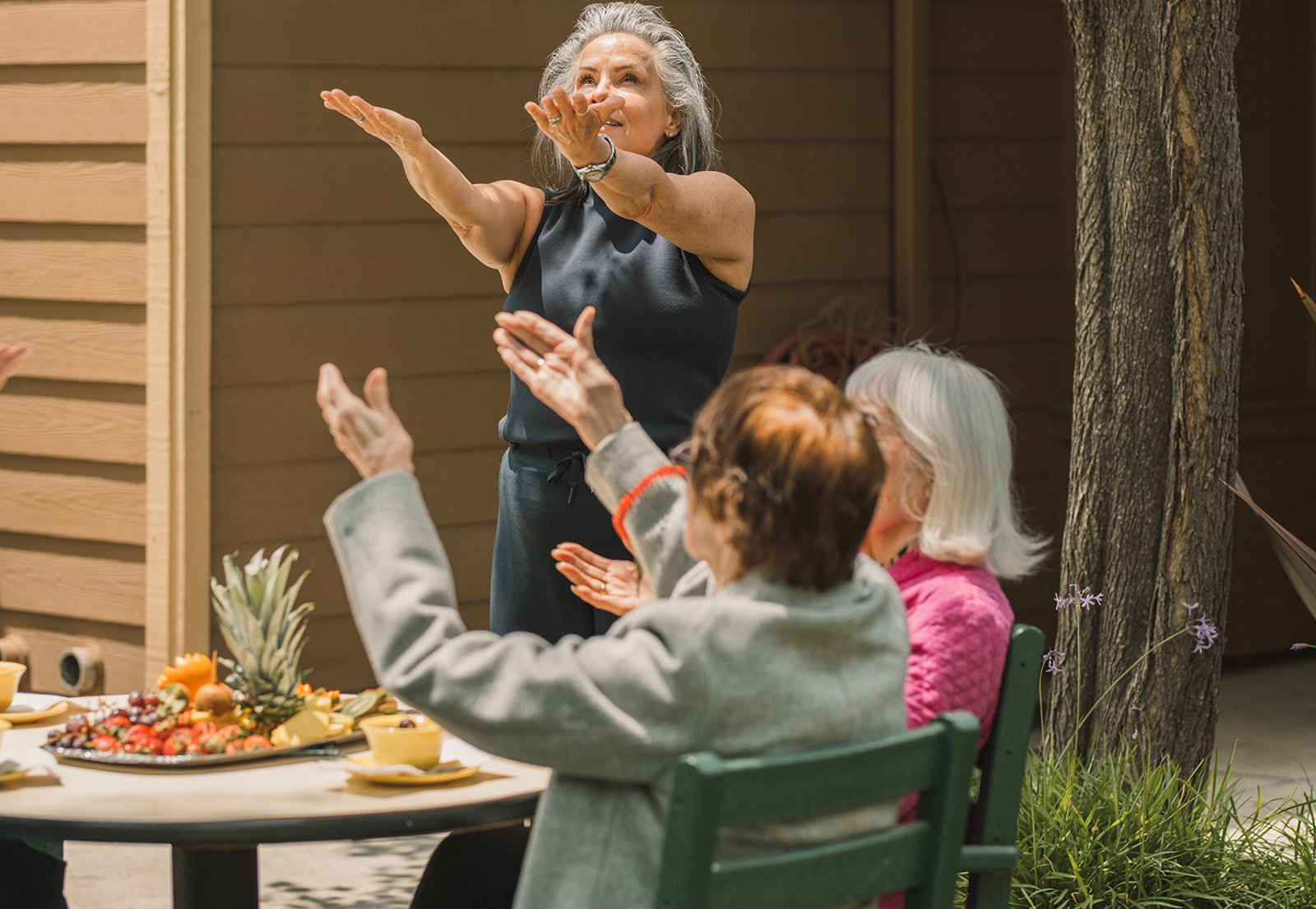Our-Community-Bottom-4-1 Senior residents enjoying the sun at Summerfield's Brookside neighborood in Stockton, CA