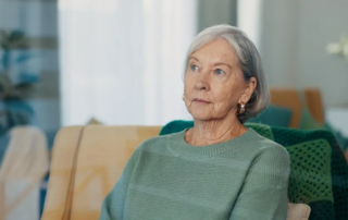 Thinking, face and senior woman on couch with dementia
